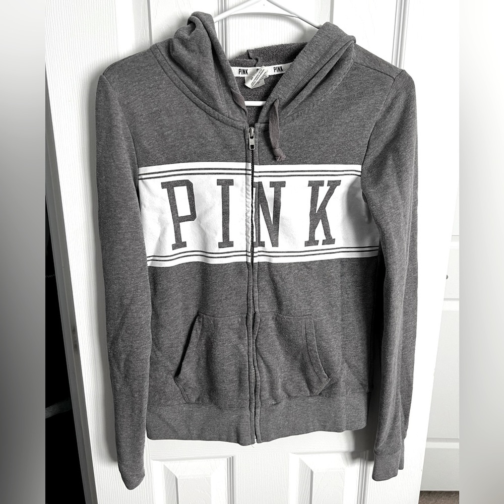 Gray zip up from PINK. Has pockets and hood. Size EXTRA SMALL. Super comfy!